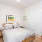 white-plantation-shutters-bedroom-closed