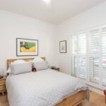 white-plantation-shutters-bedroom-open (1)