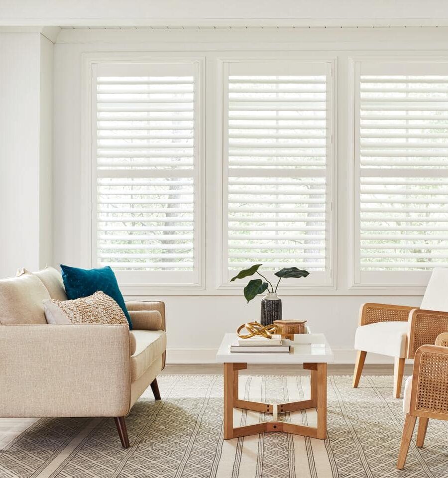 Beginner's Guide to Plantation Shutters - Complete Shopper's Checklist Are you overwhelmed by the choices available when buying plantation shutters? With so many styles, materials, and features to consider, it's easy to feel lost and unsure about making the right decision for your home. Our Beginner's Guide to Plantation Shutters offers a complete shopper's checklist, breaking down everything you need to know to make an informed and confident purchase. 1. Measuring Your Windows Accurate measurements ensure your plantation shutters fit perfectly and function properly. Here’s a step-by-step guide to help you measure your windows with precision. First, determine whether you want an inside mount or an outside mount. For inside mounts, measure the width and height of the window recess at three points: top, middle, and bottom for width; left, centre, and suitable for height. Use the smallest measurements to ensure a snug fit. For outside mounts, measure the width and height of the window frame, adding extra space for the shutter frame to overlap. Depending on your preference and the shutter style, this overlap typically ranges from 5 to 7 centimetres on each side. Ensure you use a steel tape measure for accuracy and note your measurements in millimetres for precision. Check for any obstructions, such as window handles or locks that might affect the installation. If your windows are not perfectly square, consider using a shimming technique or custom-made shutters to ensure a proper fit. 2. Choosing the Right Material Selecting the suitable material for your plantation shutters is essential for ensuring durability, aesthetics, and functionality. Each material offers distinct benefits that cater to different needs and environments. Wooden shutters are renowned for their classic and elegant appearance. They provide a warm, natural look and can be customised with various stains and finishes to match your interior decor. However, they require more maintenance and can be susceptible to moisture and humidity, making them less suitable for bathrooms and kitchens. Faux wood shutters, made from composite materials, offer the aesthetic appeal of natural wood but with enhanced durability. They are resistant to moisture and humidity, making them ideal for high-moisture areas like bathrooms and kitchens. They are also easier to maintain and clean compared to wooden shutters. Vinyl shutters are the most cost-effective option. They are incredibly durable, easy to clean, and moisture-resistant, making them perfect for any room in the house. However, they might not have the same refined appearance as wood or faux wood shutters. When choosing the material, consider the room’s environment, your budget, and the desired aesthetic. Understanding these factors will help you select the material that best meets your needs, ensuring your plantation shutters are both beautiful and practical. 3. Selecting the Louver Size Choosing the right louvre size for your plantation shutters is crucial for balancing light control, privacy, and aesthetic appeal. Each size offers distinct benefits that can enhance the functionality and look of your shutters. Smaller louvres provide a more traditional and classic appearance. They are ideal for smaller windows or rooms with a more delicate and detailed look. These louvres can create a cosy atmosphere but may limit the light entering the room and the outside view, making them less suitable for spaces where you desire ample natural light and a wide view. Medium-sized louvres strike a balance between traditional and modern styles. They offer reasonable light control and visibility while maintaining a classic appearance. These versatile louvres work well in various room sizes and styles, providing sufficient light and privacy control without overwhelming the space. Larger louvres are perfect for a contemporary and spacious look. They provide the best visibility and maximum light control, making them ideal for more oversized windows and rooms where you want an unobstructed view and plenty of natural light. These louvres can make a room feel more open and airy but may look out of place in smaller, more traditional settings. When selecting the louvre size, consider your room’s size, window dimensions, and desired aesthetic. Larger louvres are excellent for open, modern spaces, allowing more light and a clearer view. They are particularly effective in living rooms and dining areas. Smaller louvres suit more traditional, cosy settings, such as bedrooms or study rooms, where privacy and a classic look are prioritised. 4. Customisation Options Plantation shutters offer a wide range of customisation options, allowing you to create a look that perfectly suits your home’s decor and style. Understanding these options will help you make informed decisions to achieve the desired aesthetic and functionality. Wood, faux wood, and vinyl are popular materials, each offering different durability, maintenance, and appearance benefits. The colour and finish options are extensive, from classic whites and neutrals to bold, custom colours. This flexibility ensures that your shutters can seamlessly blend with or stand out against your existing decor. Louvre sizes vary, allowing you to control light and privacy levels. Tilt options include the traditional tilt rod, which runs down the centre of the shutter, and hidden tilt, which offers a cleaner, more modern look by positioning the tilt mechanism out of sight. Additionally, you can choose between inside or outside mounts to achieve the desired fit and appearance. 5. Budgeting for Plantation Shutters Budgeting for plantation shutters involves considering several factors to ensure you get the best value for your investment without compromising quality and aesthetics. Here’s a detailed breakdown to help you plan your budget effectively. Material costs are a primary consideration. Wooden shutters are typically more expensive due to their premium look and customisation options. Faux wood shutters offer a middle ground, providing the wood look with added durability and moisture resistance at a slightly lower cost. Vinyl shutters are the most cost-effective, offering durability and ease of maintenance but with a less refined appearance. Customisation options can also impact your budget. Special finishes, custom colours, and unique louvre sizes may increase costs. Opting for hidden tilt mechanisms or motorised controls can add to the expense but offer enhanced functionality and a sleeker look. Installation costs should also be factored in. While some homeowners may choose DIY installation to save money, professional installation ensures a perfect fit and can prevent potential issues. Maintenance and repair costs: High-quality shutters may have a higher upfront cost but often require less maintenance and have a longer lifespan, providing better long-term value. 6. Installation Process Installing plantation shutters correctly is crucial for their functionality and aesthetic appeal. Here’s a detailed step-by-step guide to help you understand the process. 1. Preparation Before you begin, ensure accurate window measurements, considering whether you opt for an inside or outside mount. Gather all necessary tools, including a drill, screws, level, measuring tape, and a screwdriver. Ensure you have a clean, clear workspace to lay out the shutters and frames. 2. Mounting frames For inside mounts, position the frame inside the window recess. Check that it is level and square using a spirit level. Mark the screw holes with a pencil, then drill pilot holes to prevent the wood from splitting. Secure the frame with screws, ensuring it remains level throughout the process. For outside mounts, place the frame on the wall around the window. Ensure it’s centred and level, then mark, drill, and screw in place. The outside mount will typically require more support, so ensure it’s firmly attached to the wall. 3. Attaching the panels Once the frame is secure, attach the shutter panels using the provided hinges. Start by attaching the hinges to the panels first, then to the frame. Ensure the panels are level and can open and close smoothly. It’s helpful to have an extra pair of hands to hold the panels in place while you secure the hinges. Adjust the hinges if necessary to achieve a perfect fit and ensure even spacing between panels. 4. Final adjustments Check that the louvres open and close correctly and that there are no gaps between the panels and the frame. Adjust the tilt mechanism to ensure smooth operation. Tighten all screws securely and double-check that everything is level and aligned. If your shutters have a magnetic catch or other closing mechanism, ensure they are aligned and function properly. 5. Professional installation A professional installer will have the experience and tools to ensure a perfect fit and avoid potential issues arising from incorrect installation. This can save you time and ensure the longevity and performance of your shutters. Maintenance and Care Proper maintenance and care are essential to keep your plantation shutters looking their best and functioning smoothly for years. Here’s a detailed guide to help you maintain and care for your shutters: Regular Dusting: Use a soft, dry cloth or a feather duster to remove dust from the louvres and frames. Regular dusting prevents the build-up of grime and keeps your shutters looking fresh. For deeper cleaning, use a vacuum cleaner with a brush attachment to reach into crevices and between louvres. This is particularly useful for removing dust in hard-to-reach areas. Spot Cleaning: Dampen a cloth with mild soap and water, then gently wipe the affected area. This method effectively removes dirt and minor stains without damaging the shutters. Avoid using harsh chemicals or abrasive cleaners to prevent damage to the shutter finish. These substances can strip the paint or protective coating, leading to premature wear. Lubricating Hinges: Apply a small amount of silicone-based lubricant to the hinges to prevent squeaking and ensure easy movement of the panels. Regular lubrication maintains smooth operation and extends the life of the hinges. Inspecting for Damage: Check periodically for signs of wear, such as loose screws, chipped paint, or cracked louvres. Early detection allows for timely repairs, preventing minor issues from becoming major problems. Tighten any loose screws and touch up paint as needed to prevent further damage. Regular maintenance keeps your shutters secure and looking their best. Avoiding Excessive Moisture: To reduce moisture levels, use exhaust fans in high-humidity areas like bathrooms and kitchens. Excessive moisture can cause wood shutters to warp and damage the finish. To prevent warping and damage, keep wooden shutters dry. Place them away from direct water sources and control the humidity levels in your home. Regular cleaning is usually sufficient to maintain the appearance of faux wood and vinyl shutters. These materials are more resistant to moisture but still benefit from routine care. Protecting from Direct Sunlight: Prolonged exposure to direct sunlight can cause fading and discolouration. To shield shutters from intense sunlight, use curtains or UV-protective films on windows. Consider rotating or adjusting louvres regularly to ensure even exposure and prevent one side from fading more than the other. Cleaning Hardware: Wipe down metal components such as hinges and locks with a damp cloth to remove dust and grime. This helps prevent rust and maintains the hardware's functionality. Use appropriate metal polish for stainless steel or brass hardware to keep them shining and tarnish-free. Seasonal Deep Cleaning: Perform a deep cleaning at least twice a year. Remove the shutters from their frames (if possible) and clean all components thoroughly. Check for any hidden damage or wear during this deep cleaning process to address any issues promptly. Conclusion In conclusion, choosing the right plantation shutters involves carefully considering materials, louvre sizes, customisation options, and installation. With this guide, you're now equipped to make an informed decision. Ready to transform your windows? Explore our recommended retailers and start your journey to stylish, functional shutters today!