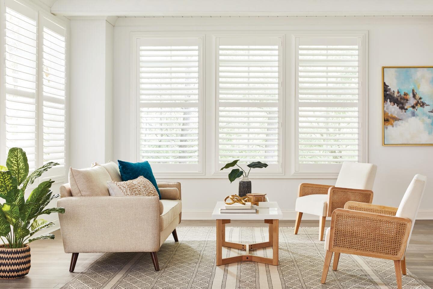 Beginner's Guide to Plantation Shutters - Complete Shopper's Checklist Are you overwhelmed by the choices available when buying plantation shutters? With so many styles, materials, and features to consider, it's easy to feel lost and unsure about making the right decision for your home. Our Beginner's Guide to Plantation Shutters offers a complete shopper's checklist, breaking down everything you need to know to make an informed and confident purchase. 1. Measuring Your Windows Accurate measurements ensure your plantation shutters fit perfectly and function properly. Here’s a step-by-step guide to help you measure your windows with precision. First, determine whether you want an inside mount or an outside mount. For inside mounts, measure the width and height of the window recess at three points: top, middle, and bottom for width; left, centre, and suitable for height. Use the smallest measurements to ensure a snug fit. For outside mounts, measure the width and height of the window frame, adding extra space for the shutter frame to overlap. Depending on your preference and the shutter style, this overlap typically ranges from 5 to 7 centimetres on each side. Ensure you use a steel tape measure for accuracy and note your measurements in millimetres for precision. Check for any obstructions, such as window handles or locks that might affect the installation. If your windows are not perfectly square, consider using a shimming technique or custom-made shutters to ensure a proper fit. 2. Choosing the Right Material Selecting the suitable material for your plantation shutters is essential for ensuring durability, aesthetics, and functionality. Each material offers distinct benefits that cater to different needs and environments. Wooden shutters are renowned for their classic and elegant appearance. They provide a warm, natural look and can be customised with various stains and finishes to match your interior decor. However, they require more maintenance and can be susceptible to moisture and humidity, making them less suitable for bathrooms and kitchens. Faux wood shutters, made from composite materials, offer the aesthetic appeal of natural wood but with enhanced durability. They are resistant to moisture and humidity, making them ideal for high-moisture areas like bathrooms and kitchens. They are also easier to maintain and clean compared to wooden shutters. Vinyl shutters are the most cost-effective option. They are incredibly durable, easy to clean, and moisture-resistant, making them perfect for any room in the house. However, they might not have the same refined appearance as wood or faux wood shutters. When choosing the material, consider the room’s environment, your budget, and the desired aesthetic. Understanding these factors will help you select the material that best meets your needs, ensuring your plantation shutters are both beautiful and practical. 3. Selecting the Louver Size Choosing the right louvre size for your plantation shutters is crucial for balancing light control, privacy, and aesthetic appeal. Each size offers distinct benefits that can enhance the functionality and look of your shutters. Smaller louvres provide a more traditional and classic appearance. They are ideal for smaller windows or rooms with a more delicate and detailed look. These louvres can create a cosy atmosphere but may limit the light entering the room and the outside view, making them less suitable for spaces where you desire ample natural light and a wide view. Medium-sized louvres strike a balance between traditional and modern styles. They offer reasonable light control and visibility while maintaining a classic appearance. These versatile louvres work well in various room sizes and styles, providing sufficient light and privacy control without overwhelming the space. Larger louvres are perfect for a contemporary and spacious look. They provide the best visibility and maximum light control, making them ideal for more oversized windows and rooms where you want an unobstructed view and plenty of natural light. These louvres can make a room feel more open and airy but may look out of place in smaller, more traditional settings. When selecting the louvre size, consider your room’s size, window dimensions, and desired aesthetic. Larger louvres are excellent for open, modern spaces, allowing more light and a clearer view. They are particularly effective in living rooms and dining areas. Smaller louvres suit more traditional, cosy settings, such as bedrooms or study rooms, where privacy and a classic look are prioritised. 4. Customisation Options Plantation shutters offer a wide range of customisation options, allowing you to create a look that perfectly suits your home’s decor and style. Understanding these options will help you make informed decisions to achieve the desired aesthetic and functionality. Wood, faux wood, and vinyl are popular materials, each offering different durability, maintenance, and appearance benefits. The colour and finish options are extensive, from classic whites and neutrals to bold, custom colours. This flexibility ensures that your shutters can seamlessly blend with or stand out against your existing decor. Louvre sizes vary, allowing you to control light and privacy levels. Tilt options include the traditional tilt rod, which runs down the centre of the shutter, and hidden tilt, which offers a cleaner, more modern look by positioning the tilt mechanism out of sight. Additionally, you can choose between inside or outside mounts to achieve the desired fit and appearance. 5. Budgeting for Plantation Shutters Budgeting for plantation shutters involves considering several factors to ensure you get the best value for your investment without compromising quality and aesthetics. Here’s a detailed breakdown to help you plan your budget effectively. Material costs are a primary consideration. Wooden shutters are typically more expensive due to their premium look and customisation options. Faux wood shutters offer a middle ground, providing the wood look with added durability and moisture resistance at a slightly lower cost. Vinyl shutters are the most cost-effective, offering durability and ease of maintenance but with a less refined appearance. Customisation options can also impact your budget. Special finishes, custom colours, and unique louvre sizes may increase costs. Opting for hidden tilt mechanisms or motorised controls can add to the expense but offer enhanced functionality and a sleeker look. Installation costs should also be factored in. While some homeowners may choose DIY installation to save money, professional installation ensures a perfect fit and can prevent potential issues. Maintenance and repair costs: High-quality shutters may have a higher upfront cost but often require less maintenance and have a longer lifespan, providing better long-term value. 6. Installation Process Installing plantation shutters correctly is crucial for their functionality and aesthetic appeal. Here’s a detailed step-by-step guide to help you understand the process. 1. Preparation Before you begin, ensure accurate window measurements, considering whether you opt for an inside or outside mount. Gather all necessary tools, including a drill, screws, level, measuring tape, and a screwdriver. Ensure you have a clean, clear workspace to lay out the shutters and frames. 2. Mounting frames For inside mounts, position the frame inside the window recess. Check that it is level and square using a spirit level. Mark the screw holes with a pencil, then drill pilot holes to prevent the wood from splitting. Secure the frame with screws, ensuring it remains level throughout the process. For outside mounts, place the frame on the wall around the window. Ensure it’s centred and level, then mark, drill, and screw in place. The outside mount will typically require more support, so ensure it’s firmly attached to the wall. 3. Attaching the panels Once the frame is secure, attach the shutter panels using the provided hinges. Start by attaching the hinges to the panels first, then to the frame. Ensure the panels are level and can open and close smoothly. It’s helpful to have an extra pair of hands to hold the panels in place while you secure the hinges. Adjust the hinges if necessary to achieve a perfect fit and ensure even spacing between panels. 4. Final adjustments Check that the louvres open and close correctly and that there are no gaps between the panels and the frame. Adjust the tilt mechanism to ensure smooth operation. Tighten all screws securely and double-check that everything is level and aligned. If your shutters have a magnetic catch or other closing mechanism, ensure they are aligned and function properly. 5. Professional installation A professional installer will have the experience and tools to ensure a perfect fit and avoid potential issues arising from incorrect installation. This can save you time and ensure the longevity and performance of your shutters. Maintenance and Care Proper maintenance and care are essential to keep your plantation shutters looking their best and functioning smoothly for years. Here’s a detailed guide to help you maintain and care for your shutters: Regular Dusting: Use a soft, dry cloth or a feather duster to remove dust from the louvres and frames. Regular dusting prevents the build-up of grime and keeps your shutters looking fresh. For deeper cleaning, use a vacuum cleaner with a brush attachment to reach into crevices and between louvres. This is particularly useful for removing dust in hard-to-reach areas. Spot Cleaning: Dampen a cloth with mild soap and water, then gently wipe the affected area. This method effectively removes dirt and minor stains without damaging the shutters. Avoid using harsh chemicals or abrasive cleaners to prevent damage to the shutter finish. These substances can strip the paint or protective coating, leading to premature wear. Lubricating Hinges: Apply a small amount of silicone-based lubricant to the hinges to prevent squeaking and ensure easy movement of the panels. Regular lubrication maintains smooth operation and extends the life of the hinges. Inspecting for Damage: Check periodically for signs of wear, such as loose screws, chipped paint, or cracked louvres. Early detection allows for timely repairs, preventing minor issues from becoming major problems. Tighten any loose screws and touch up paint as needed to prevent further damage. Regular maintenance keeps your shutters secure and looking their best. Avoiding Excessive Moisture: To reduce moisture levels, use exhaust fans in high-humidity areas like bathrooms and kitchens. Excessive moisture can cause wood shutters to warp and damage the finish. To prevent warping and damage, keep wooden shutters dry. Place them away from direct water sources and control the humidity levels in your home. Regular cleaning is usually sufficient to maintain the appearance of faux wood and vinyl shutters. These materials are more resistant to moisture but still benefit from routine care. Protecting from Direct Sunlight: Prolonged exposure to direct sunlight can cause fading and discolouration. To shield shutters from intense sunlight, use curtains or UV-protective films on windows. Consider rotating or adjusting louvres regularly to ensure even exposure and prevent one side from fading more than the other. Cleaning Hardware: Wipe down metal components such as hinges and locks with a damp cloth to remove dust and grime. This helps prevent rust and maintains the hardware's functionality. Use appropriate metal polish for stainless steel or brass hardware to keep them shining and tarnish-free. Seasonal Deep Cleaning: Perform a deep cleaning at least twice a year. Remove the shutters from their frames (if possible) and clean all components thoroughly. Check for any hidden damage or wear during this deep cleaning process to address any issues promptly. Conclusion In conclusion, choosing the right plantation shutters involves carefully considering materials, louvre sizes, customisation options, and installation. With this guide, you're now equipped to make an informed decision. Ready to transform your windows? Explore our recommended retailers and start your journey to stylish, functional shutters today!